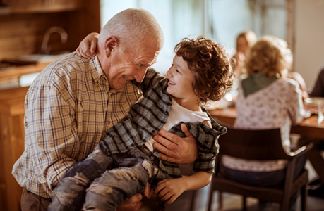 Grandfather holding grandson